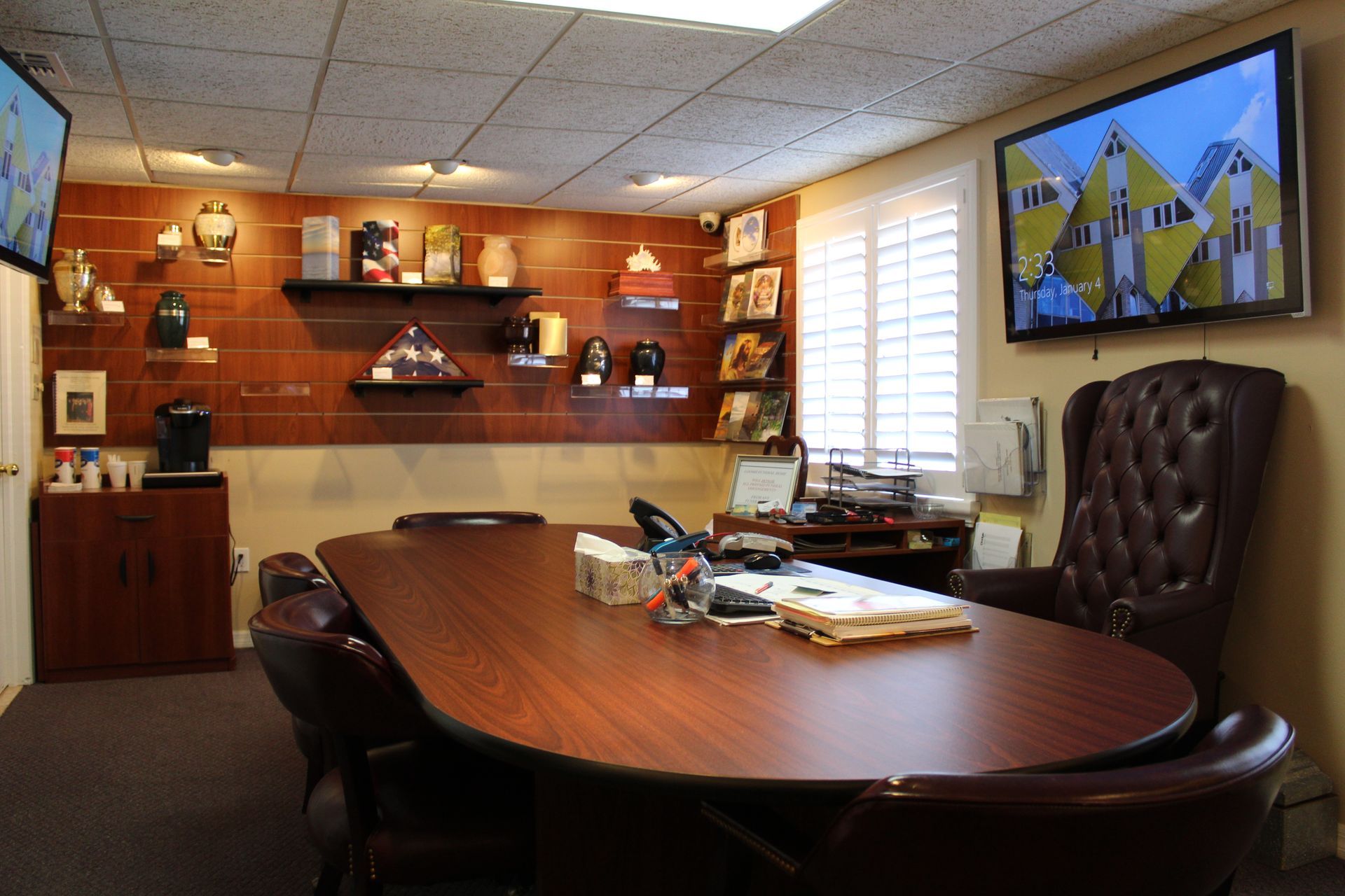 A conference room with a large table and chairs