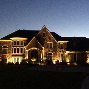 A large house that is lit up at night
