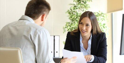 Female Assistance Talking with a Client — Legal Document Preparation in Bakersfield, CA