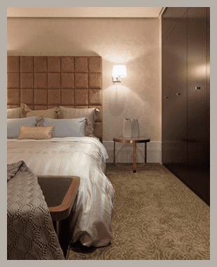 Modern bedroom with beige walls and double bed