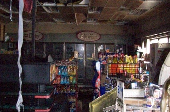 The inside of a store with a pepsi machine