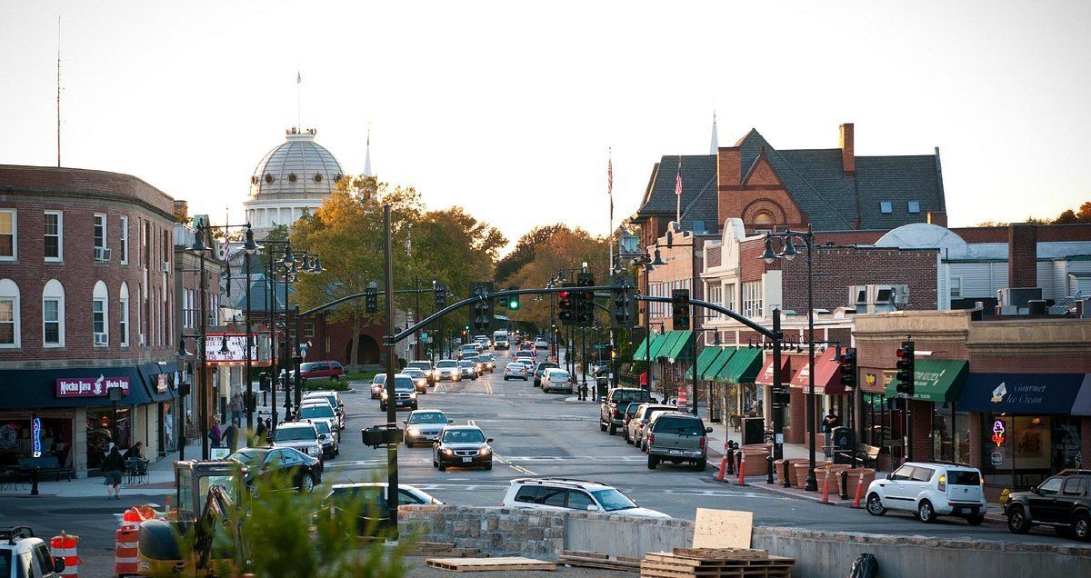 A city street with a large dome in the background