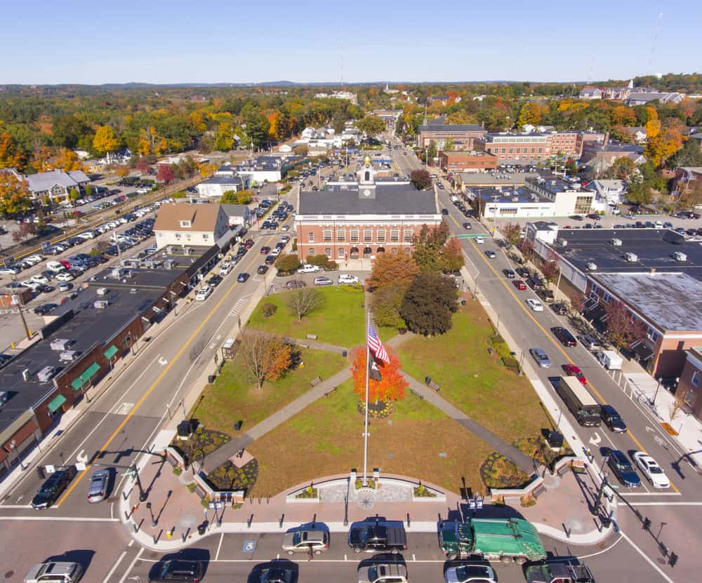 An aerial view of a small town with a large building in the middle