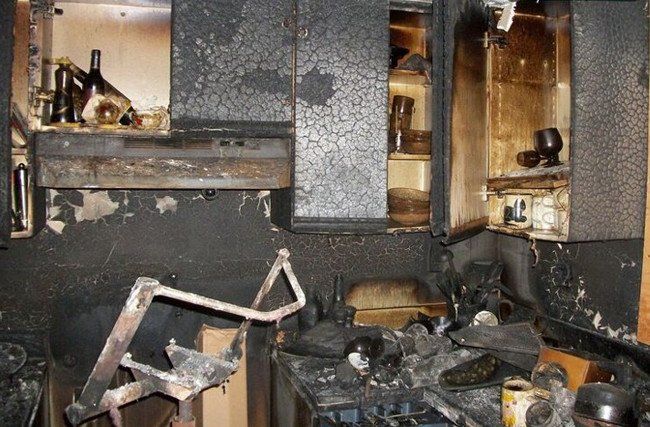 A kitchen that has been damaged by a fire.