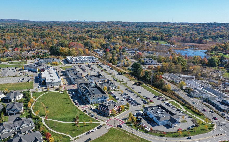 An aerial view of a city with a lot of buildings and trees.