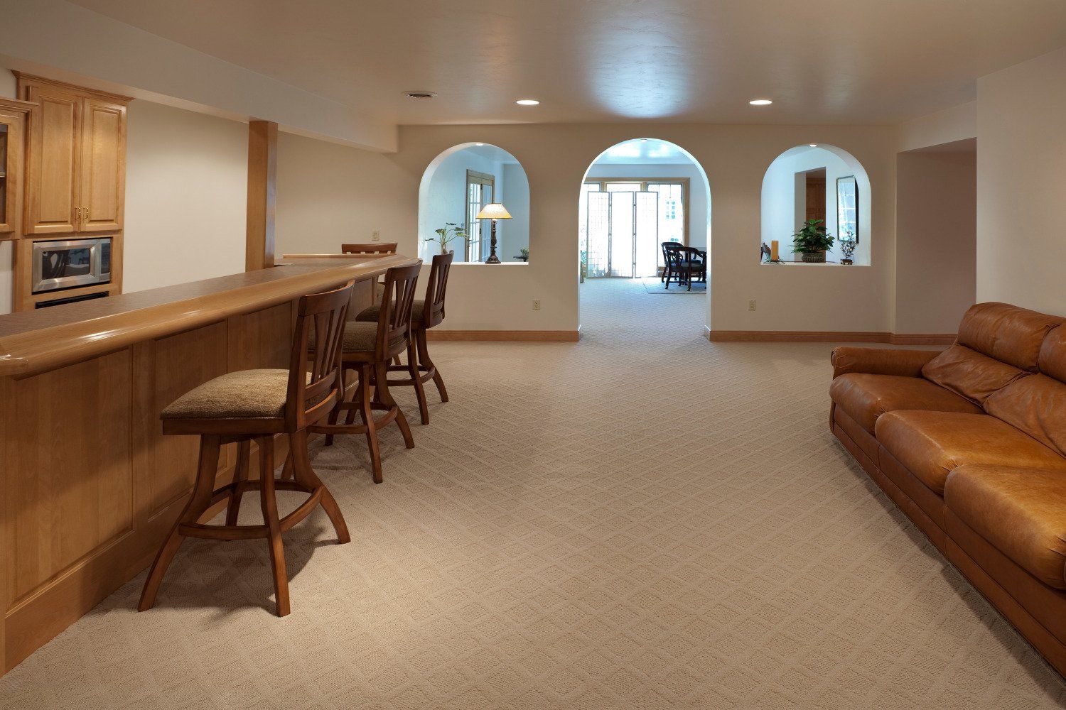 A living room with a couch and a bar