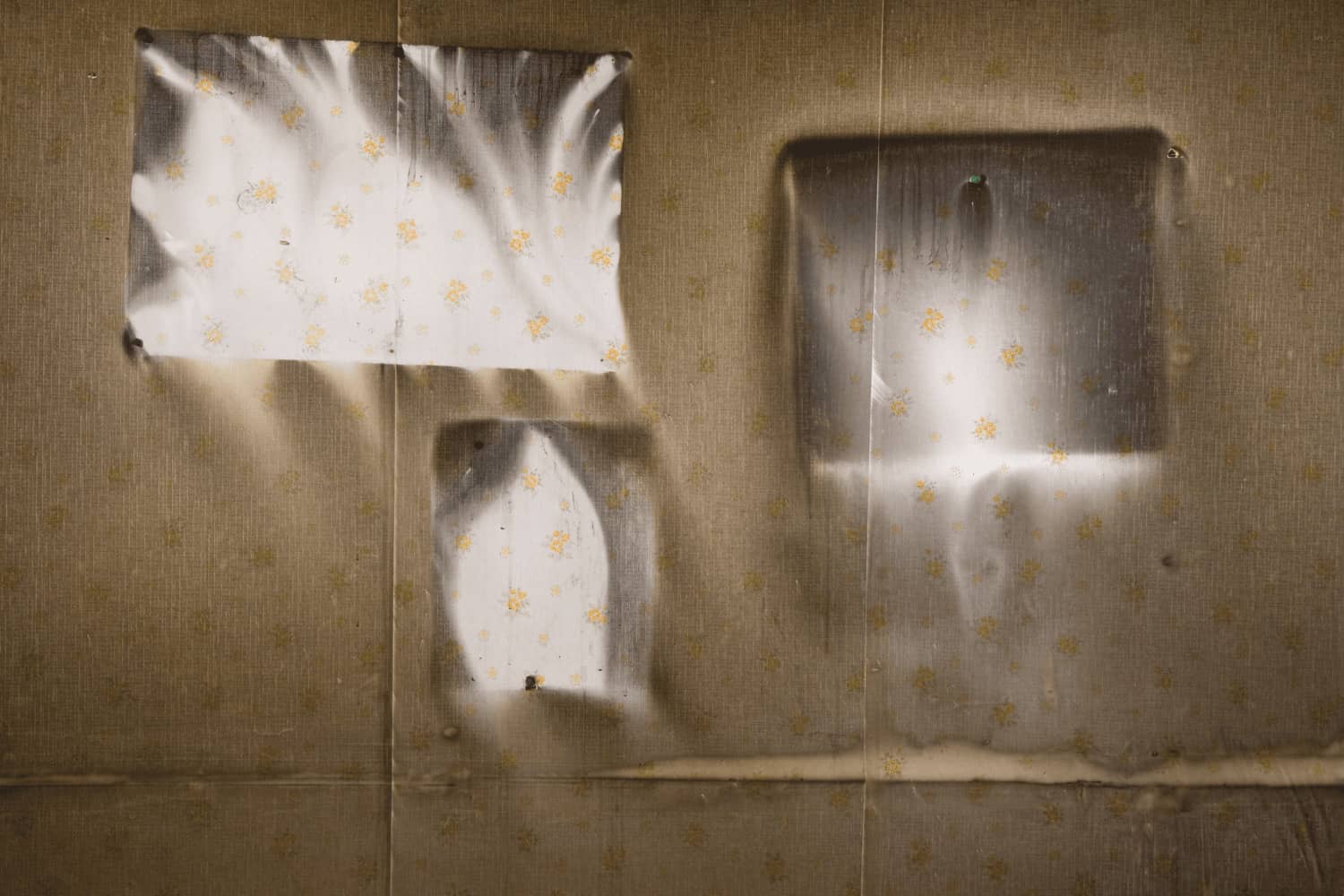 A close up of a piece of paper on a wall.