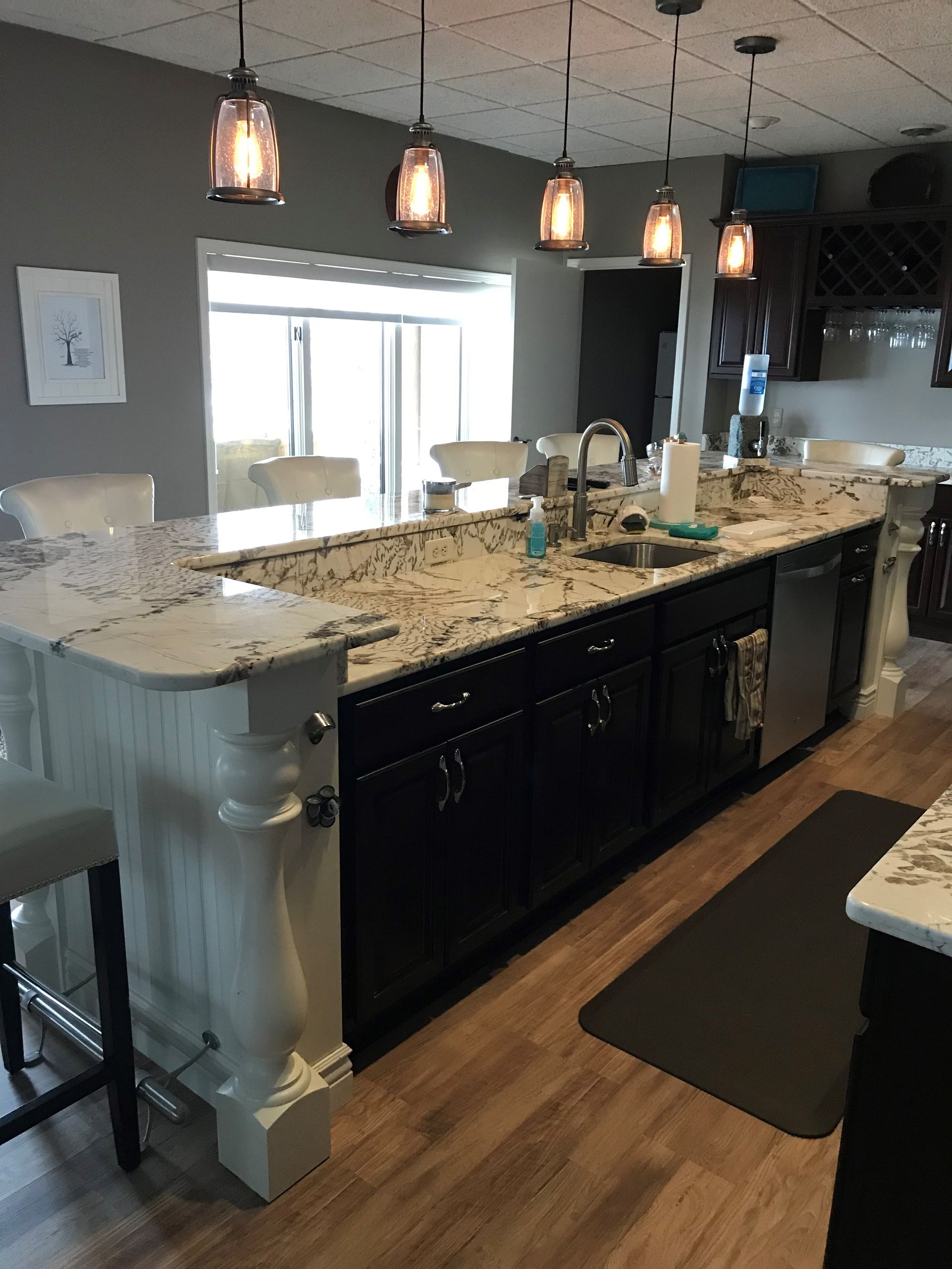 Kitchen With Granite Counter Tops Black Cabinets — Clarkston, Michigan — Hidden Lake Cabinet & Trim LLC