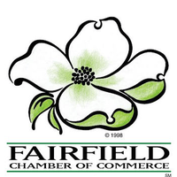 Logo of the Fairfield Chamber of Commerce: white flower with green accents, black outline, name below in green and black text.