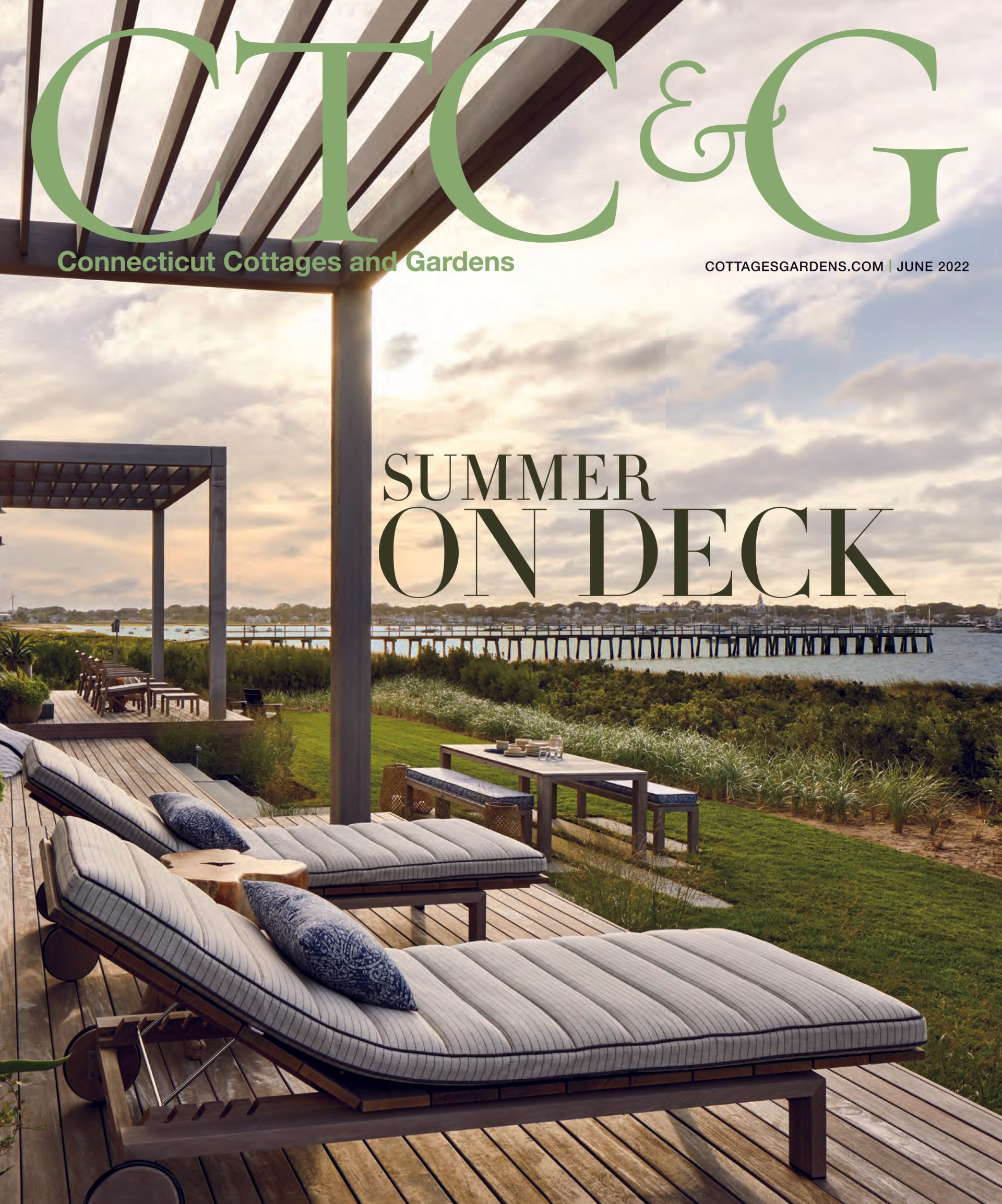 Magazine cover, outdoor deck with lounge chairs, ocean view, 