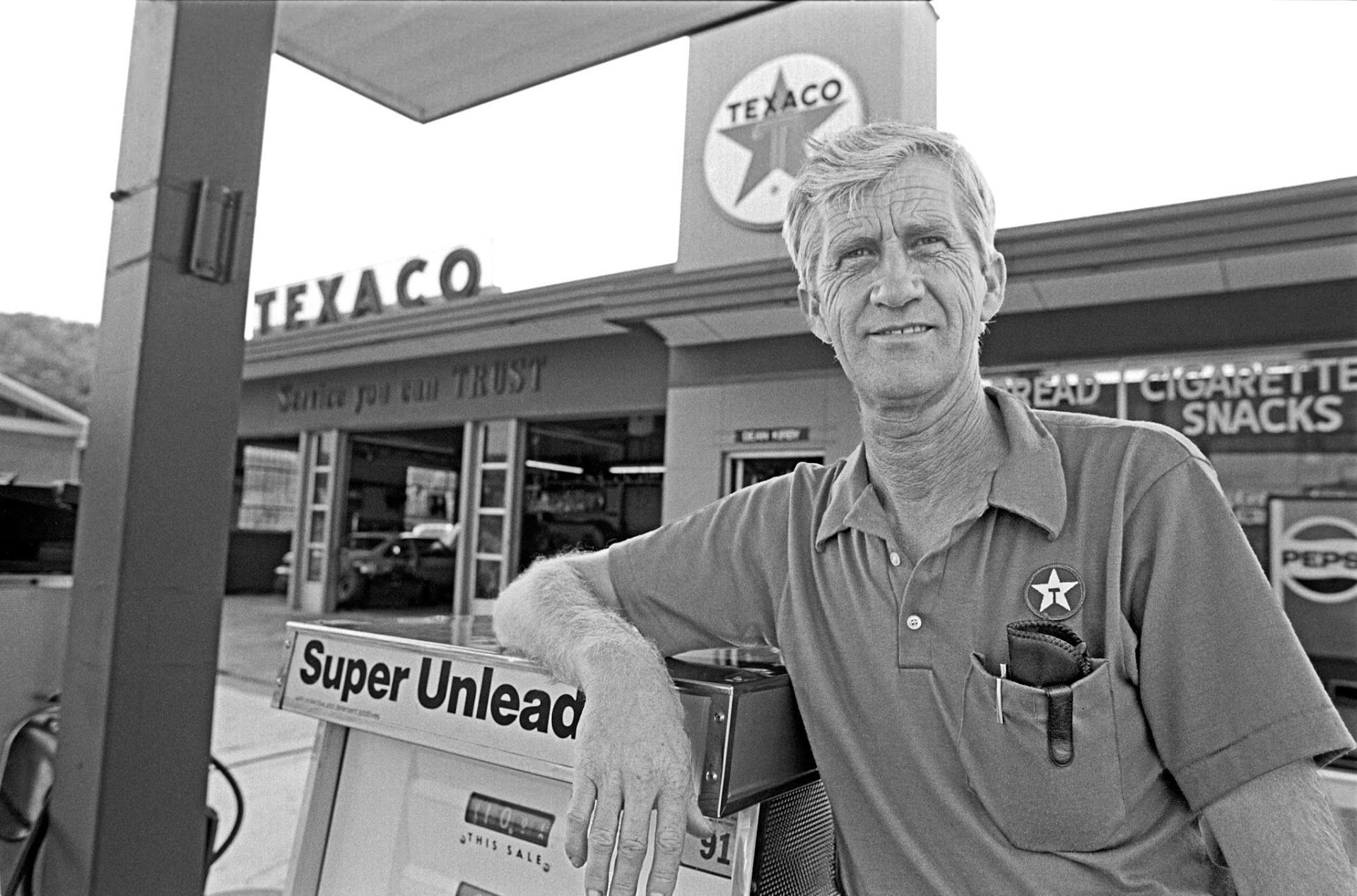 Man in front of a Texaco gas station | Kirby's Garage