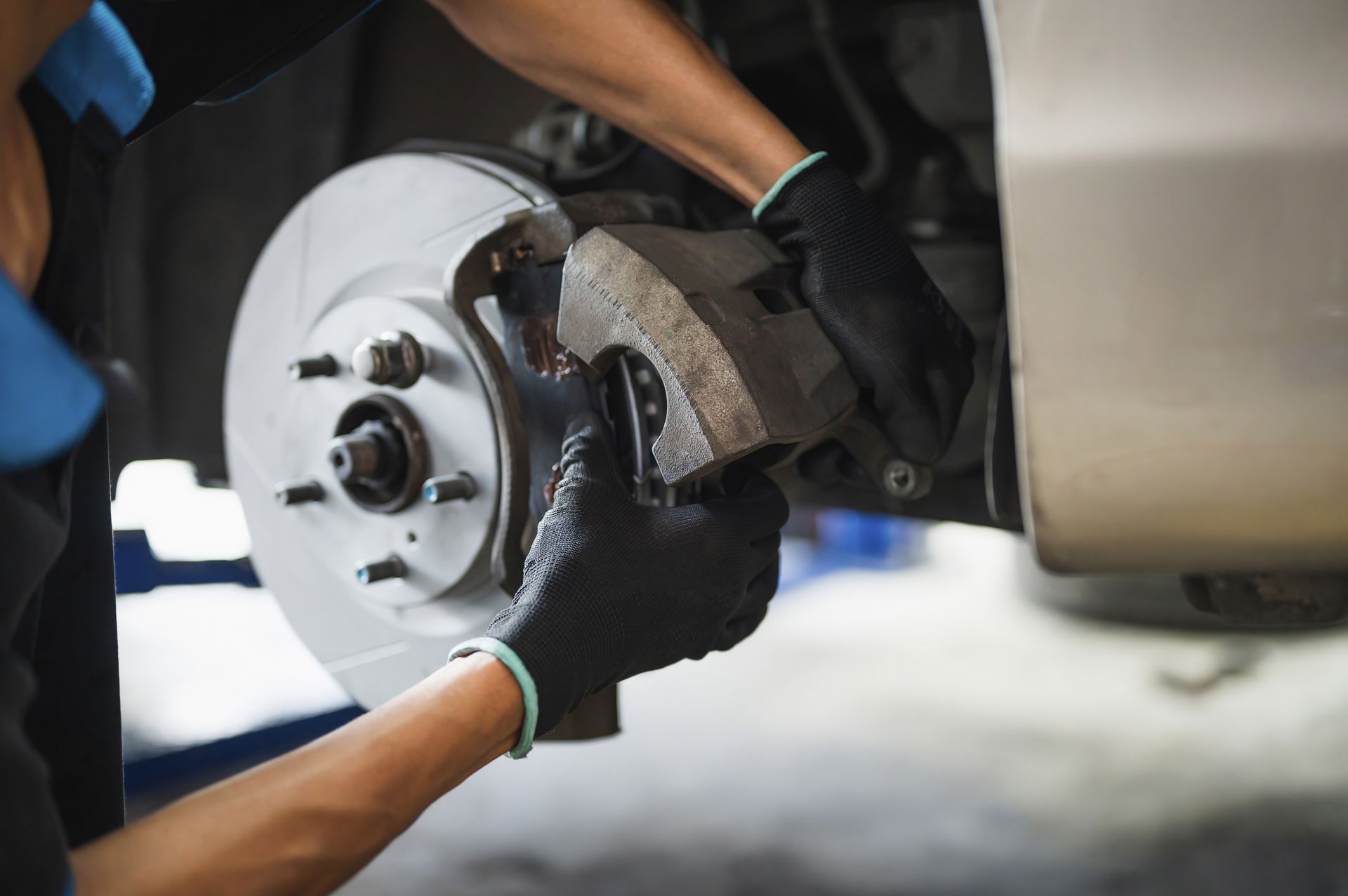 Mechanic working on brake disc | Kirby's Garage