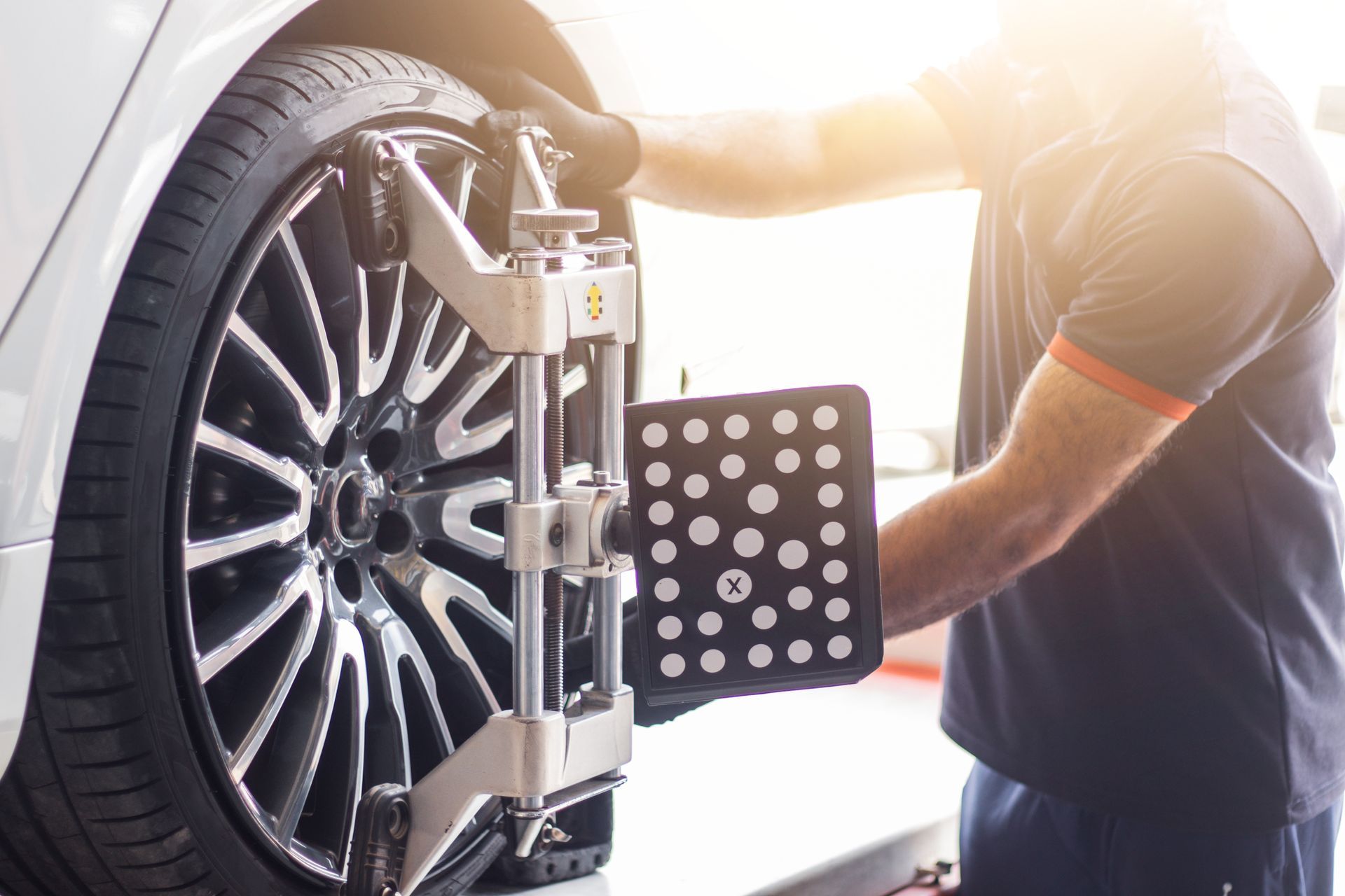 Mechanic aligning the wheel | Kirby's Garage