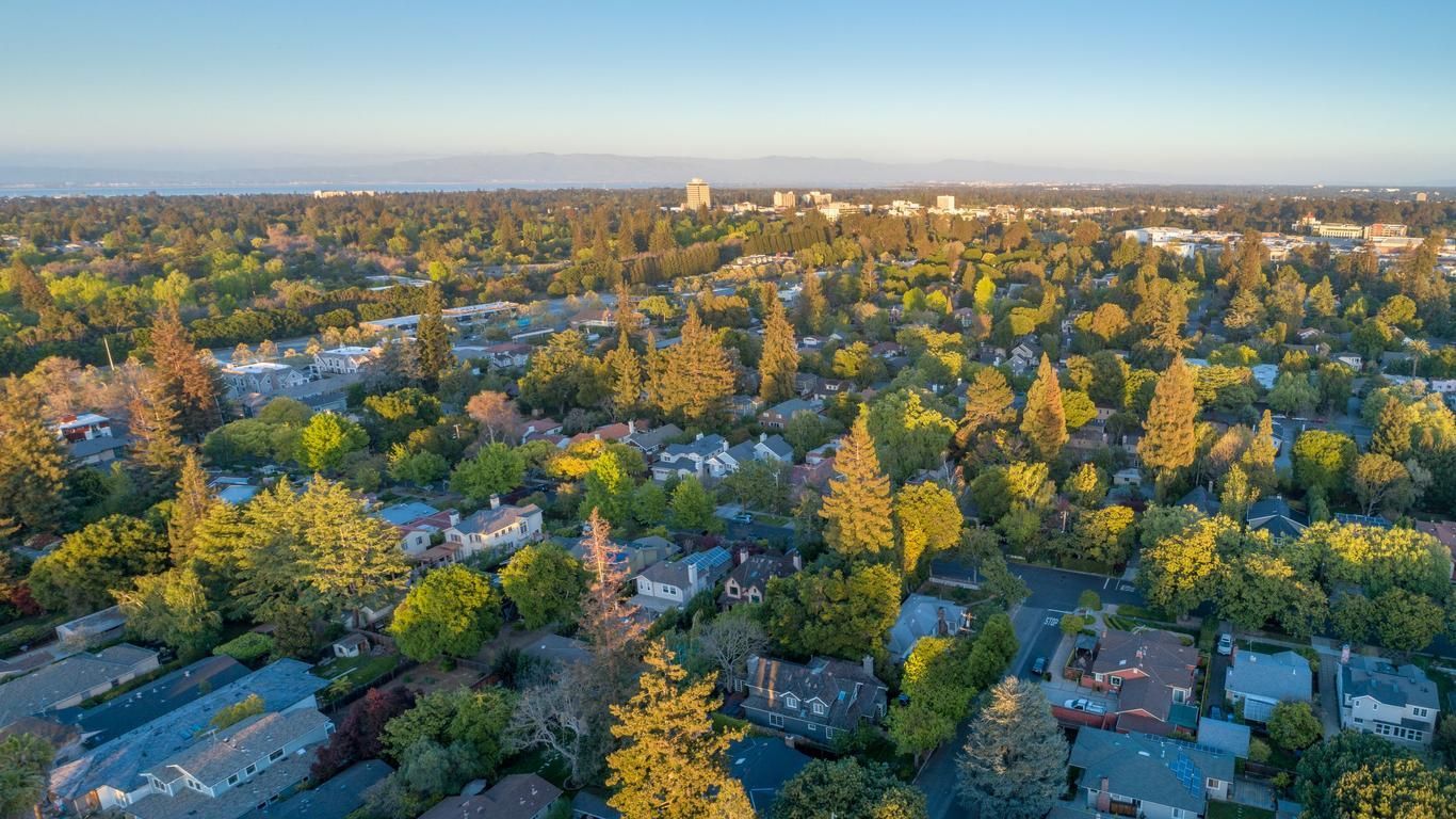 An aerial view of a residential area filled with lots of trees and houses.