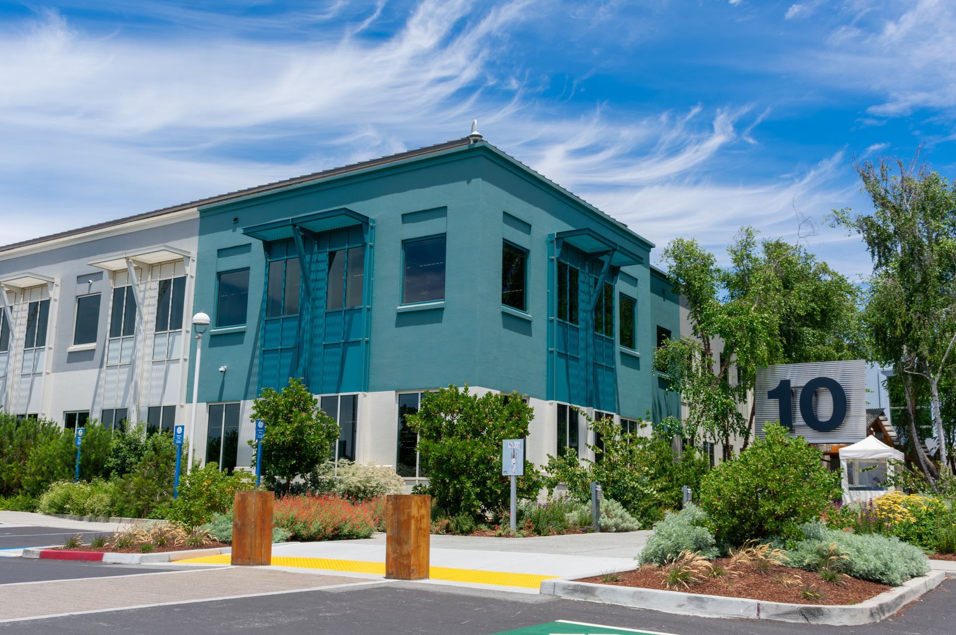A large green building with a sign that says 10 on it