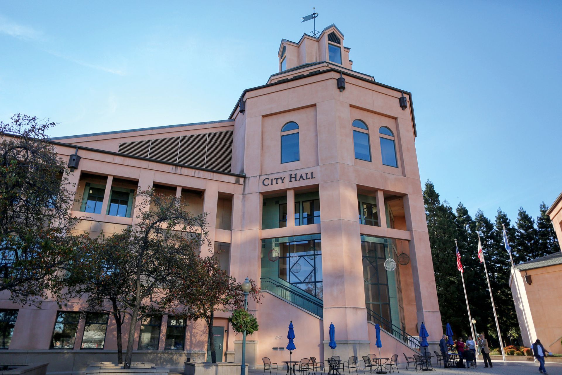 A large building with the word city hall on it