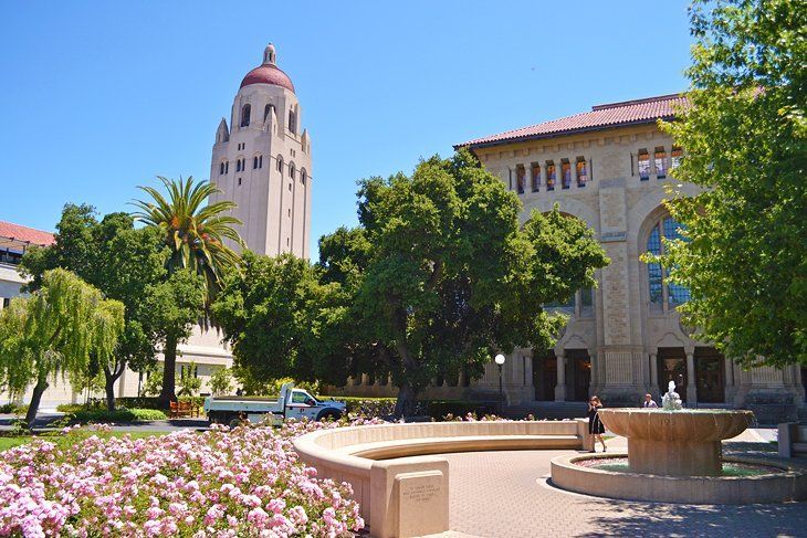 A large building with a fountain in front of it