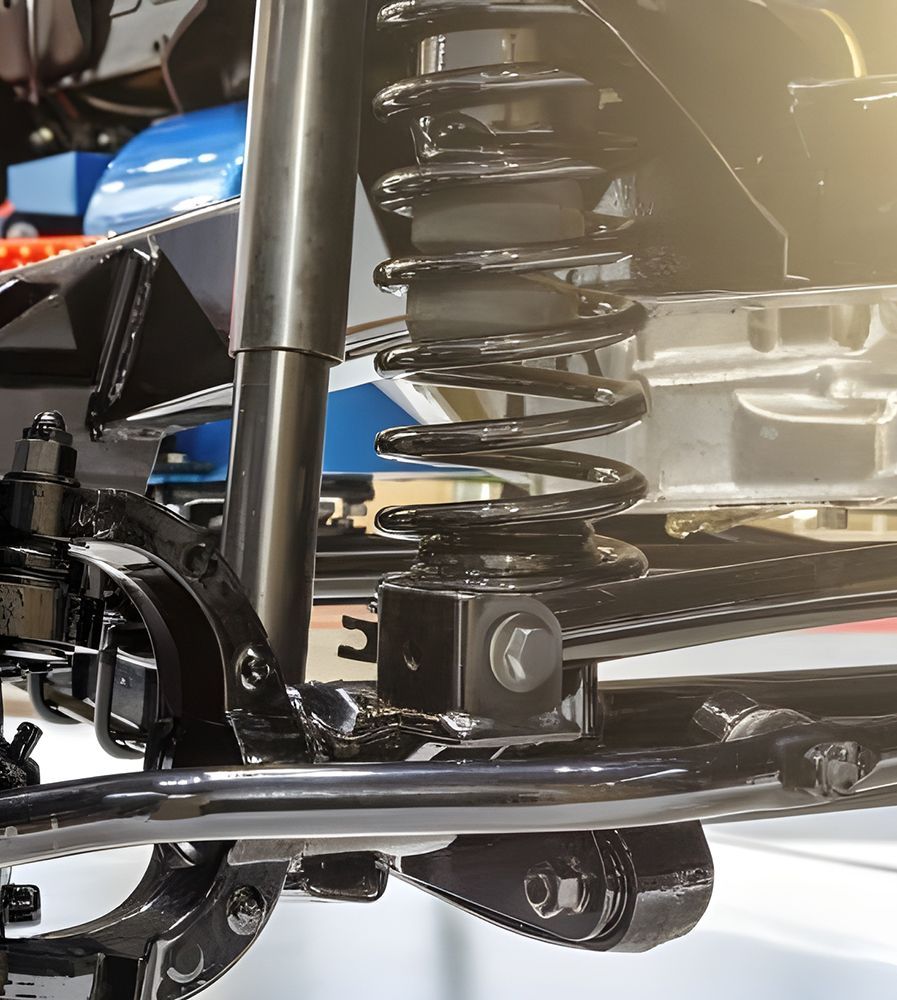 A Close Up of a Shock Absorber on a Car — Transtate Trailers & 4wd In Belconnen, ACT