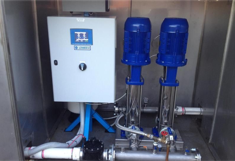Two Blue Electric Pumps with Silver Tubing and Control Panel Inside a Metal Enclosure — Sweeney's Pumps & Irrigation In Medowie, NSW