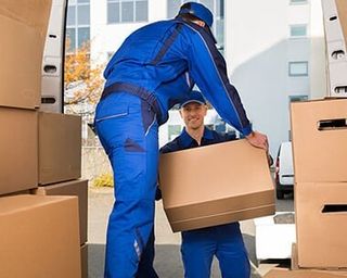 Movers Carrying Package - Moving Company in Dennis, MA