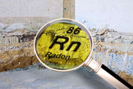 A magnifying glass shows the chemical symbol for radon