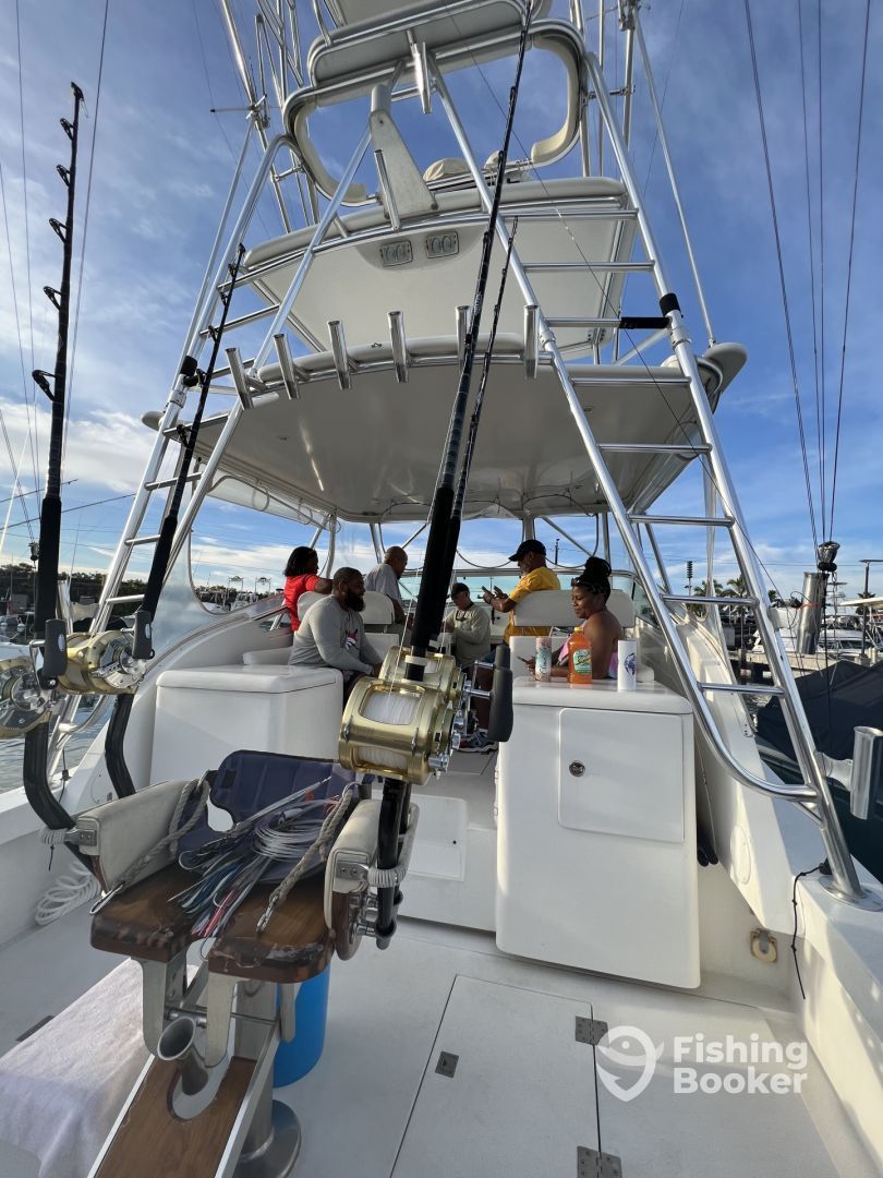 A group of people are fishing on a boat.