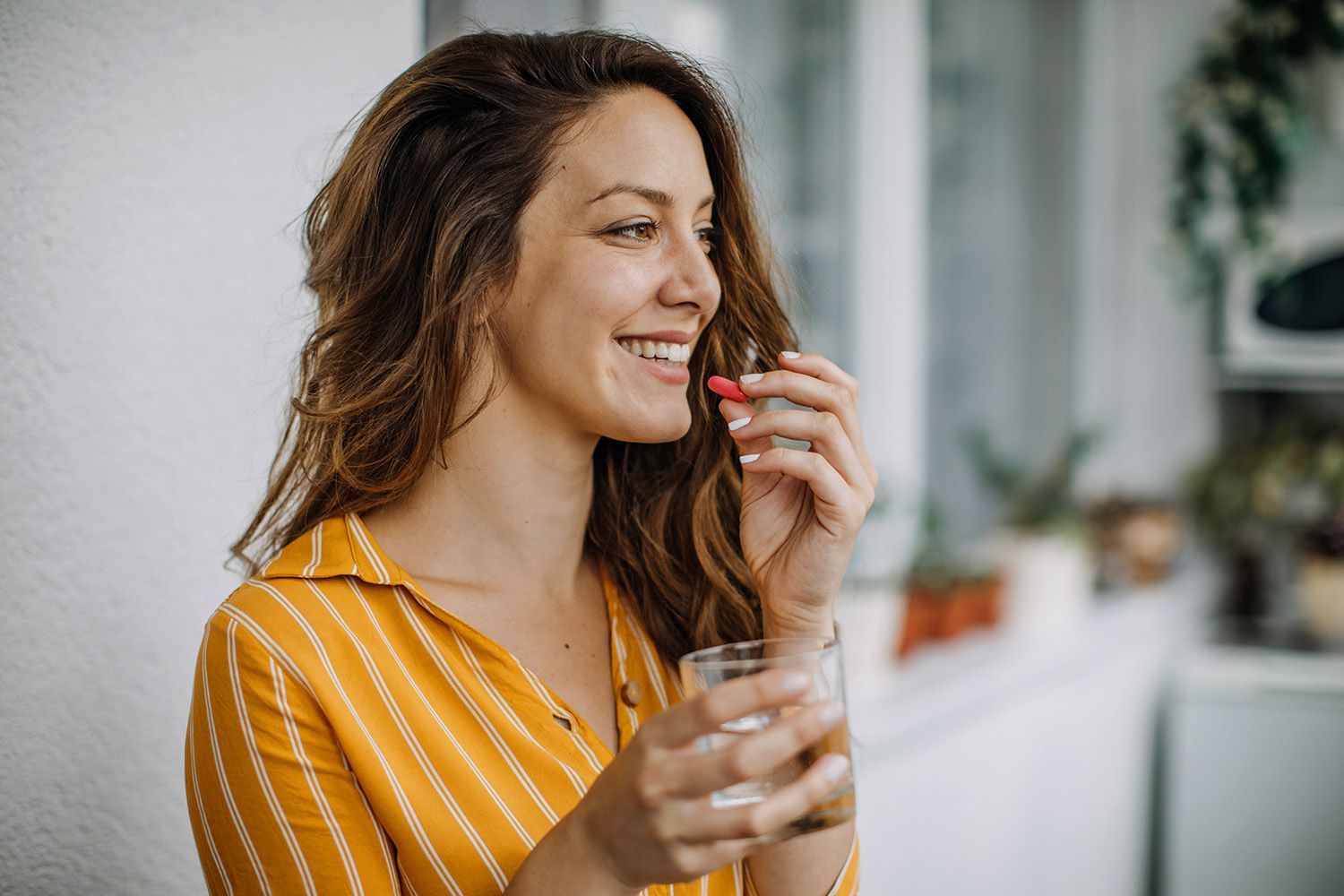 Happy Woman Drinking her Medicine Happy Woman Drinking her Medicine