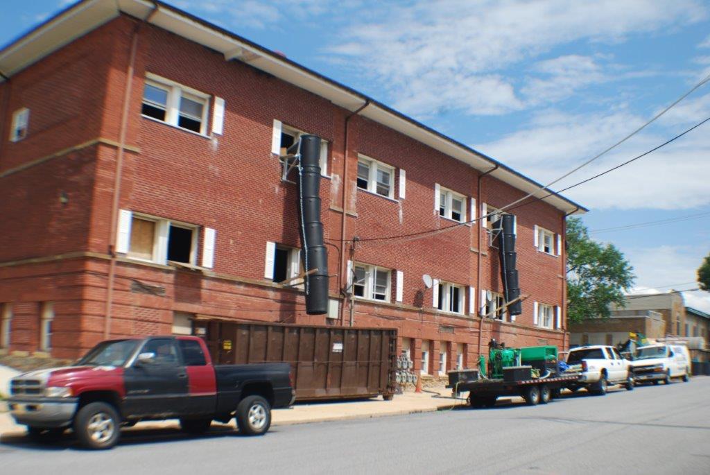 Red Building With Garbage Chute — Manchester, PA — Keystone Restorations & Builders, Inc