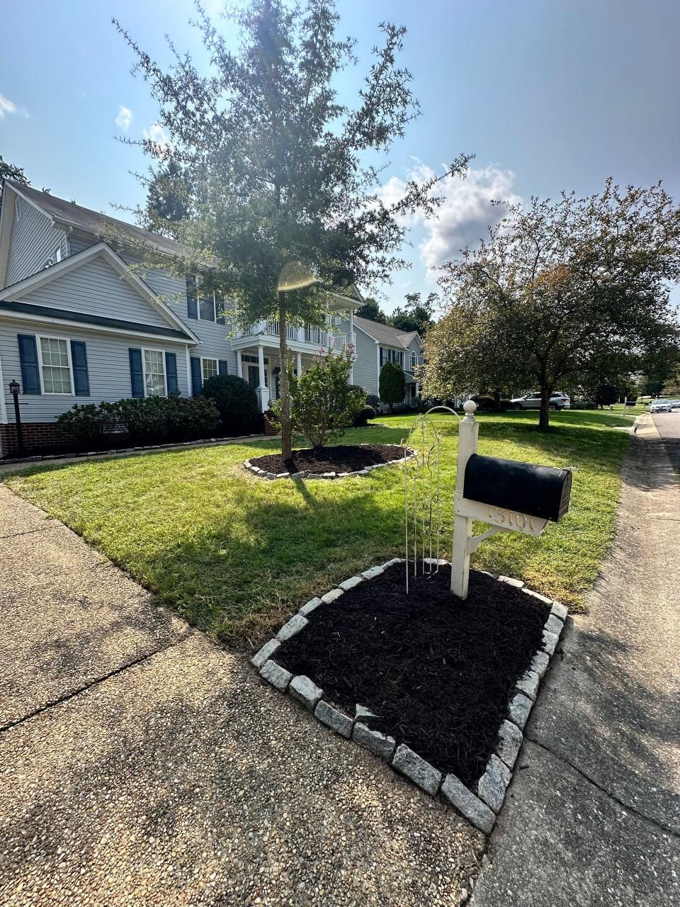 A house with a mailbox in front of it