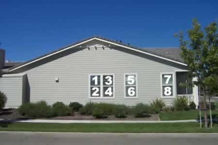 A house with numbers on the side of it