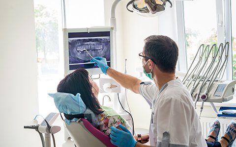 Emergency Dental — Doctor Showing the Digital X-Ray to Patient in Joliet, IL