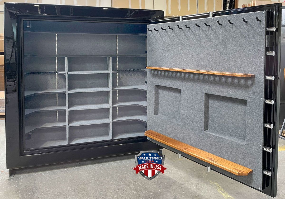 very large safe with customized interior, with long gun racks mounted on door back.