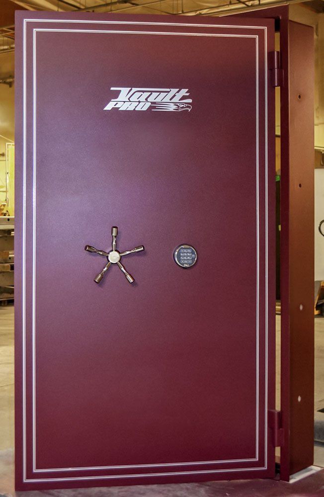 ADA compatible vault door with low set lock and door handle