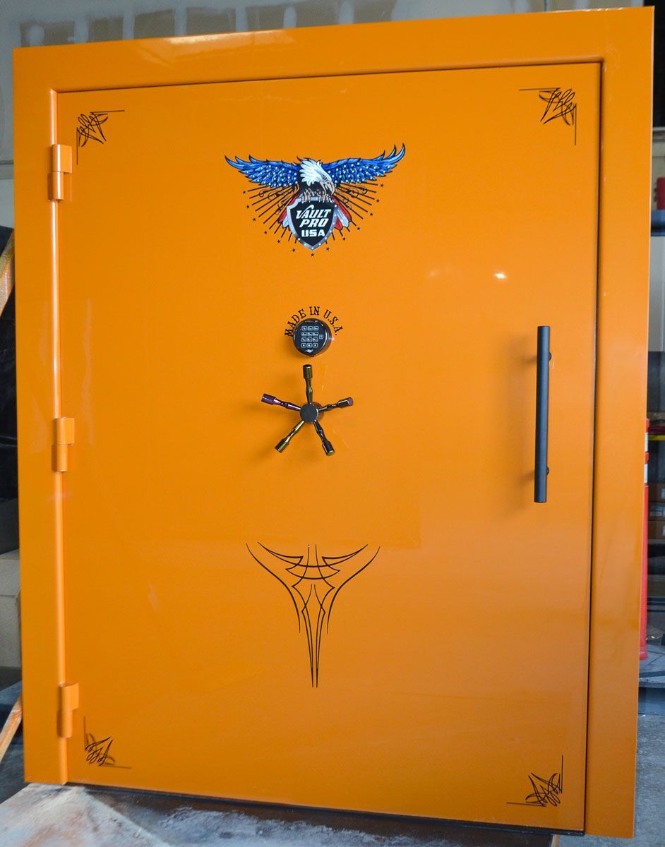 Custom giant Atlas vault door in Fusion Orange Metallic gloss finish. Triple hinges due to the size of the door.