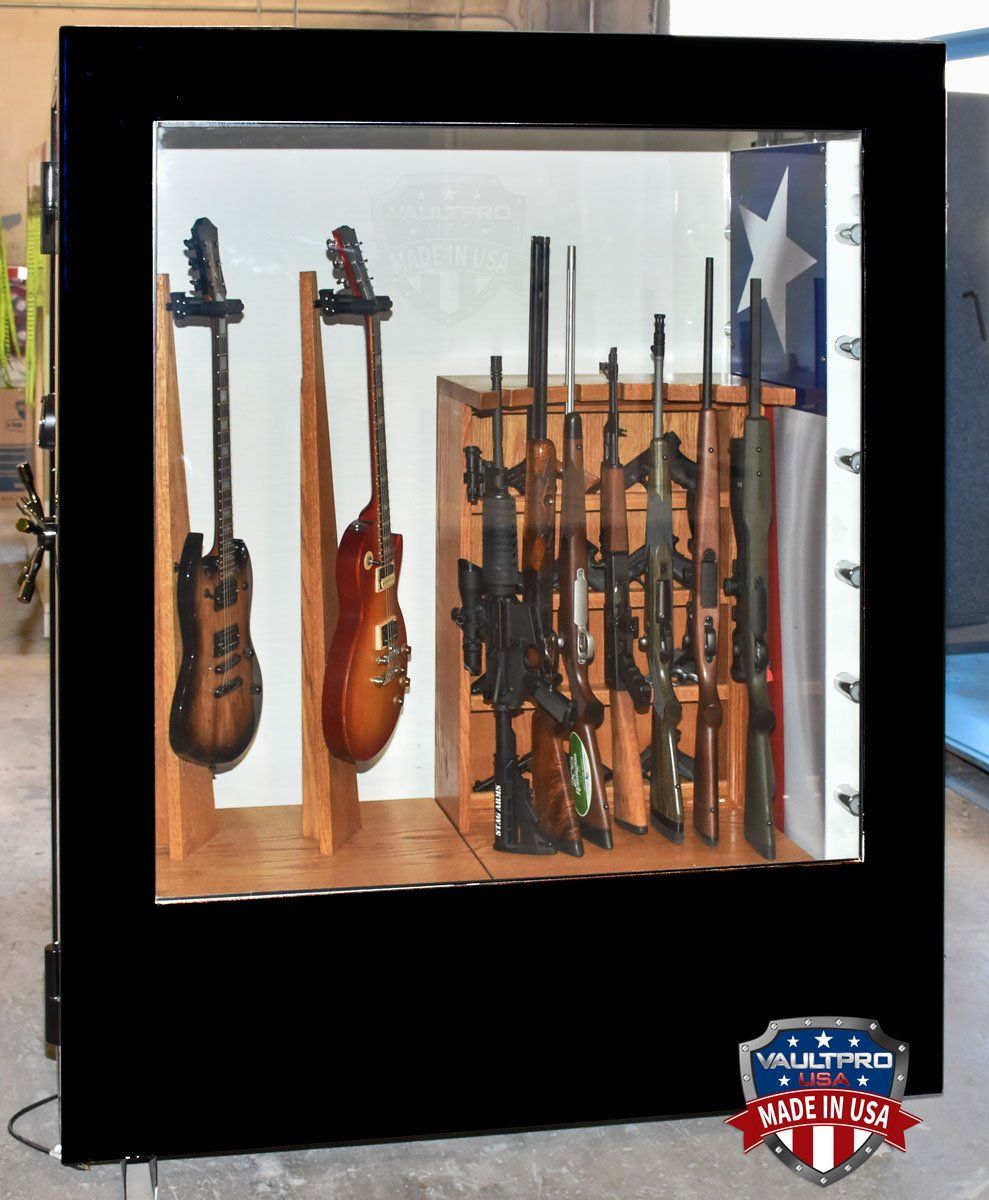 Display safe with guns and guitars