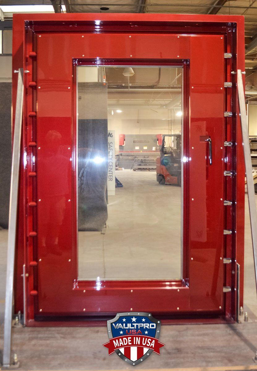 Interior of custom Elite series door showing locking bolts and emergency release handle.