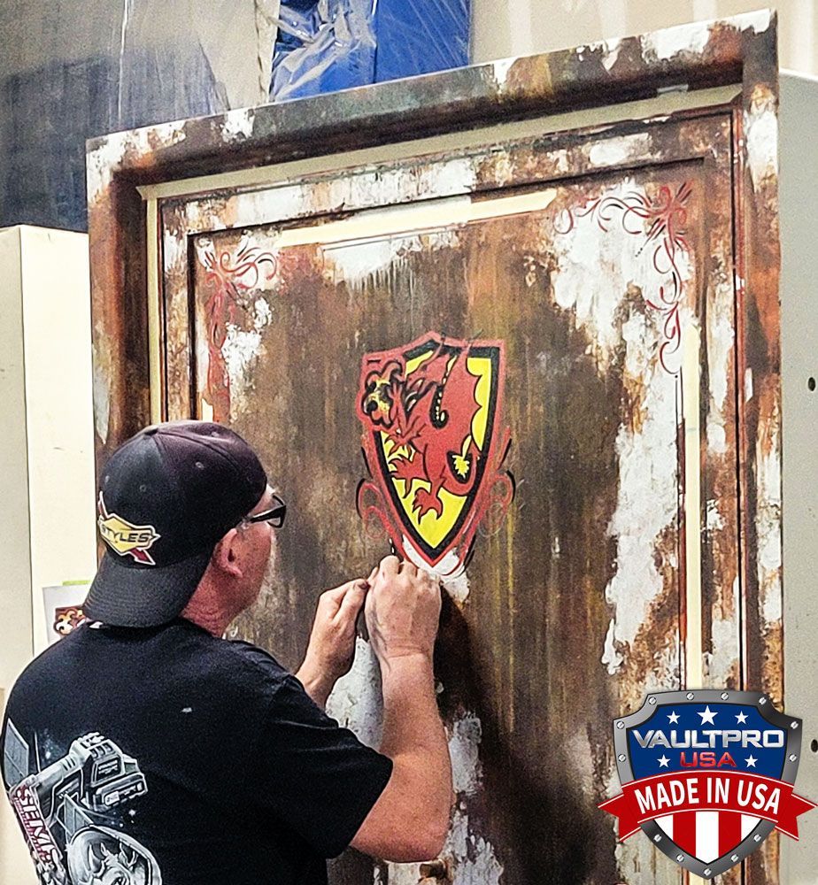 Jeff Styles custom pinstriper, adding a custom shield to vault door.