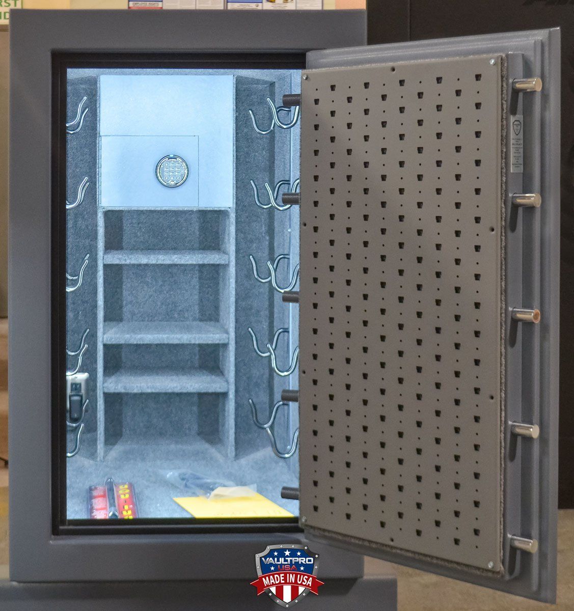 Custom safe includes: Lighting & electrical, Safe in safe, with horizontal mounting hooks for long guns on the side and tactical weapons panel behind door.