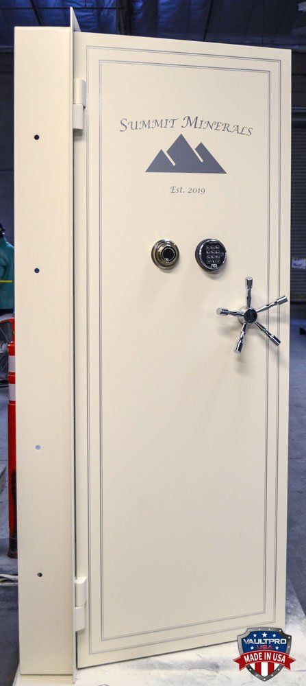 custom vault door with dual locks, offset bankers wheel and art