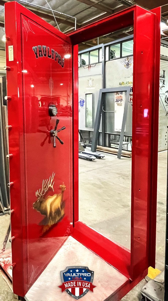 Custom Executive model vault door in premium dual-stage Laser Pearl Red gloss finish, and hand applied custom Elk art and pinstripe.