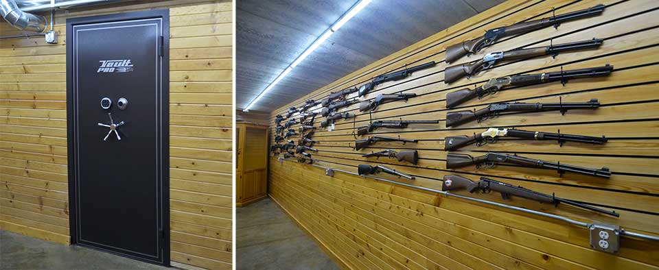 Custom gun room with wood paneling and vault door