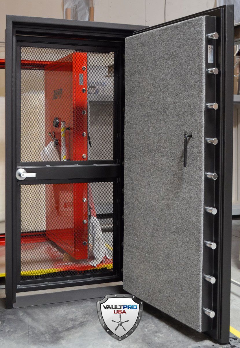 A vault door open and a mesh door day gate.