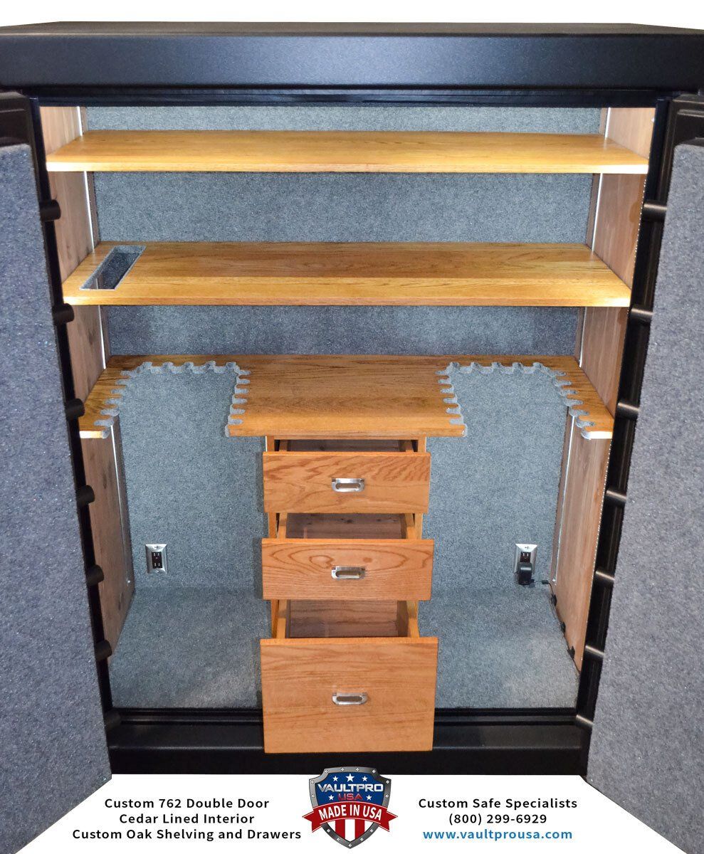 Custom double door safe is lined with cedar and fitted with custom oak gun racks, shelving and drawers.