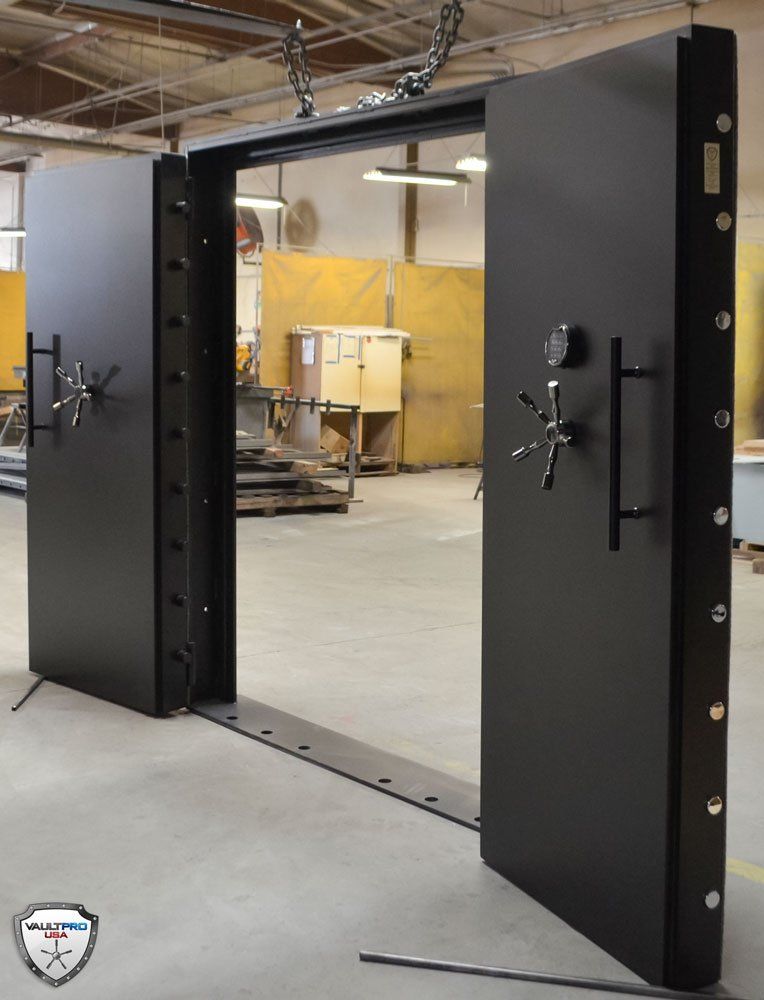 Double leaf double vault door