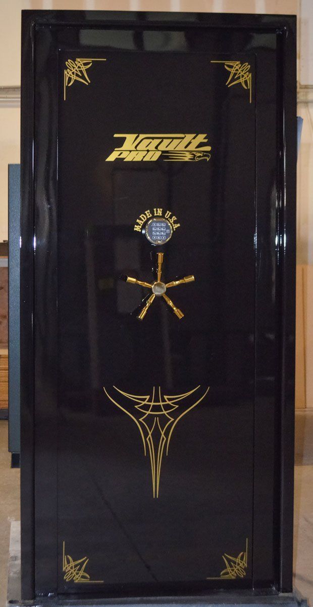 Elite In-Swinging Vault Door in optional glass black finish with gold pinstripe and hardware.