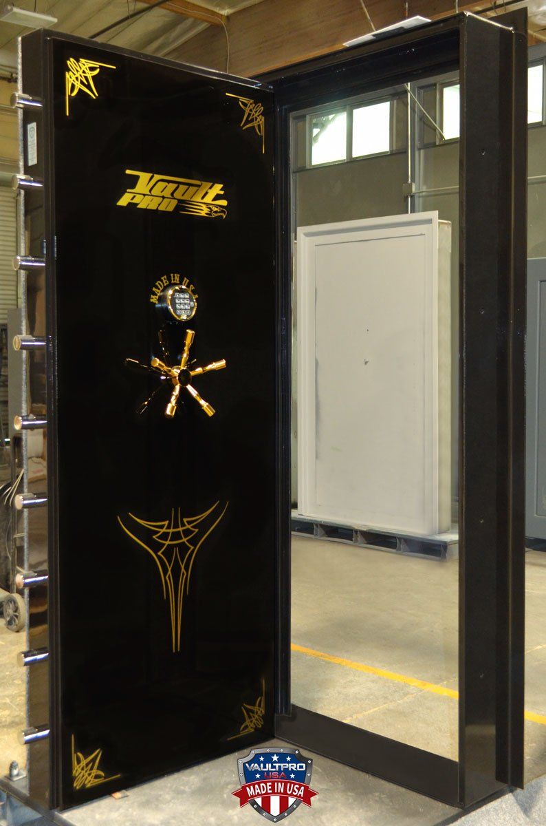 vault door in-swing model in gloss black finish with gold trim.