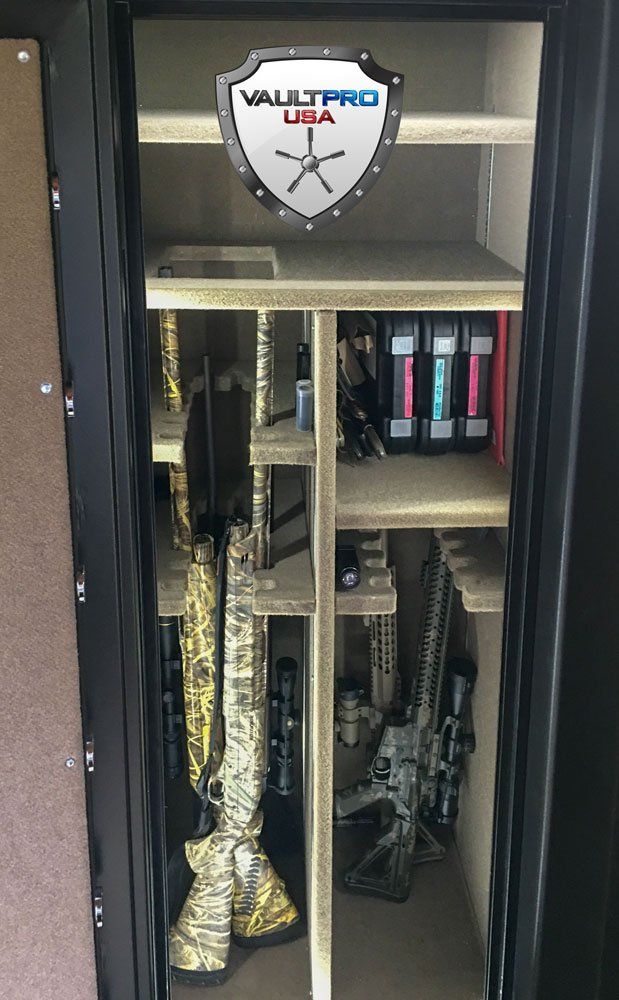 Gun safe interior with gun racks and gun storage.
