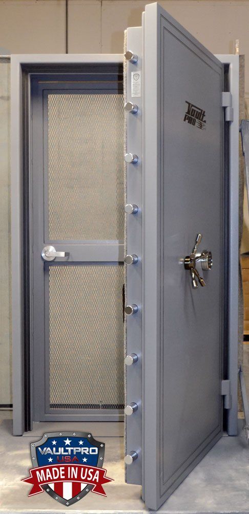heavy duty vault door fitted with day gate for secure pass through