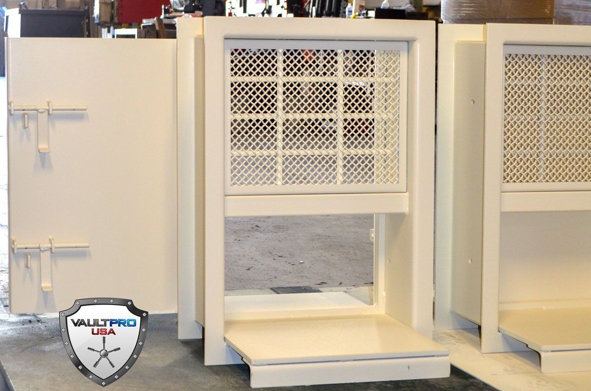 Day gates for secure pass thru in vault door rooms