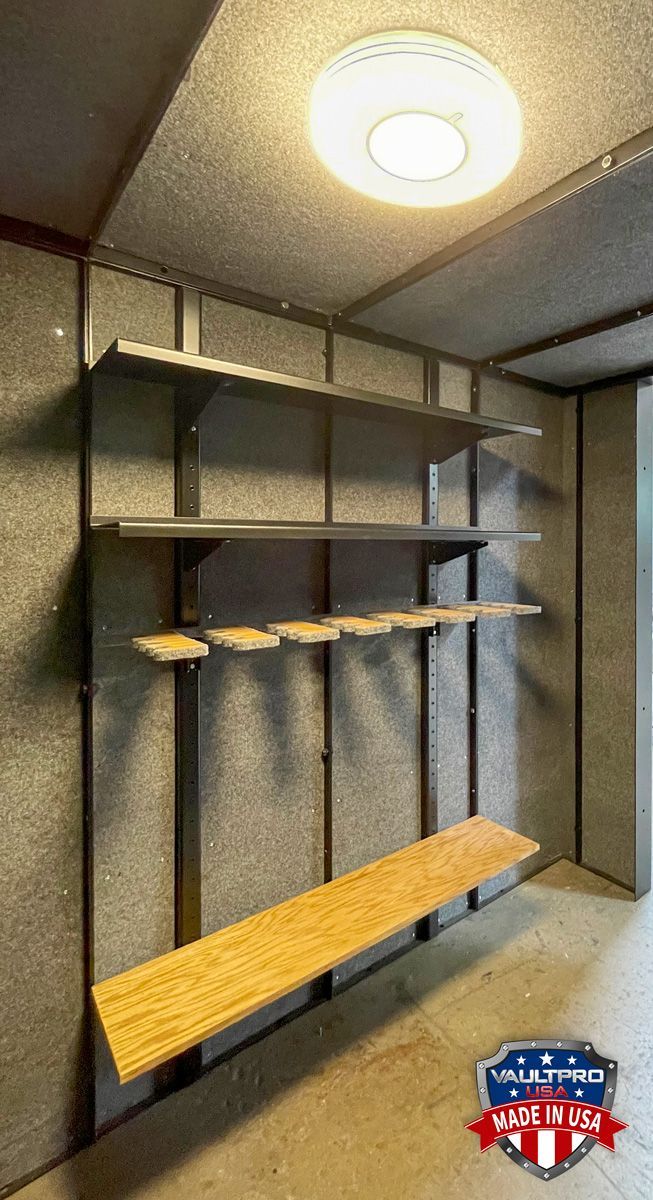 Custom vault interior with fully adjustable steel shelving and gun racks.